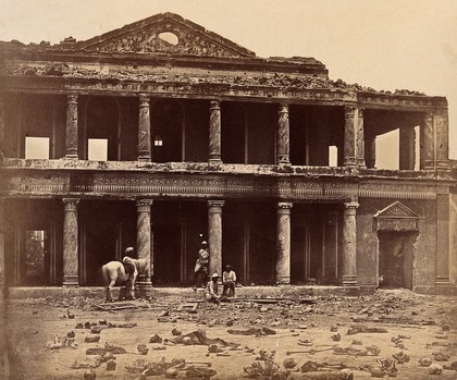 Lucknow, India: the Secundra Bagh showing damage done during the Indian Rebellion; skeletons of murdered Indian rebels lie on the ground. Photograph by Felice Beato, ca. 1858.