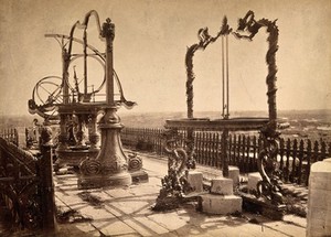 view Jesuit observatory, Beijing, China: bronze astronomical instruments displayed on decorative stands. Photograph, ca. 1860.