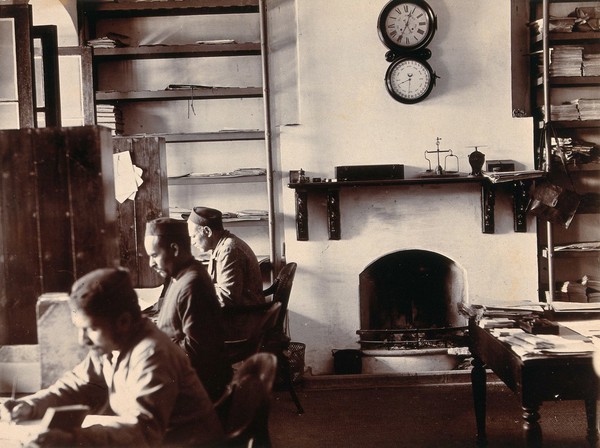 Imperial Bacteriological Laboratory, Muktesar, Punjab, India: laboratory office interior: staff seated at desks. Photograph, 1897.