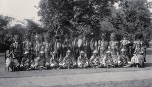 view The Maidan park, Calcutta, India: traditional Bhutan Devil dancers, some wearing masks: group portrait. Photograph, 1906.