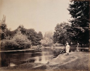 view Kashmir: a small boat on the Dhul canal, with onlookers. Photograph by Samuel Bourne.