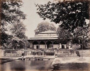 view Kashmir: a bungalow above a weir. Photograph by Samuel Bourne.