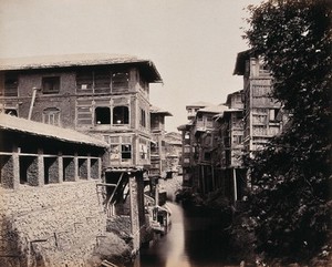 view Kashmir: merchants' houses above the Marqual canal. Photograph by Samuel Bourne.