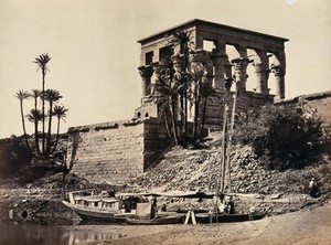 view The Hypaethral Temple, Philae, Egypt; a narrow boat in the foreground. Photograph by Francis Frith, ca. 1857.