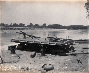 view Menufia Canal, Egypt: reconstruction work to the first Aswan Dam: a sluice gate ready for rivetting. Photograph by F. Fiorillo, 1910.