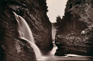 view Keiman's Gat, South Africa: cliffs with a waterfall and river. Woodburytype, 1888, after a photograph by Robert Harris.