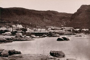 view Simon's Town, South Africa: part of town, sea and hills. Woodburytype, 1888, after a photograph by Robert Harris.