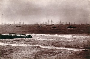 view Algoa Bay, South Africa: a bay with pier and ships. Woodburytype, 1888, after a photograph by Robert Harris.