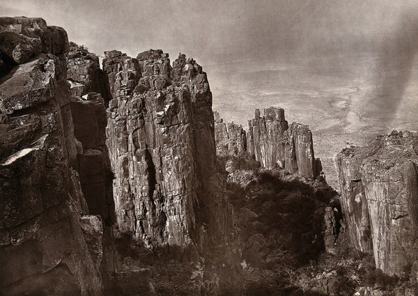 Valley of Desolation, South Africa: rock formations overlooking a valley. Woodburytype, 1888, after a photograph by Robert Harris.