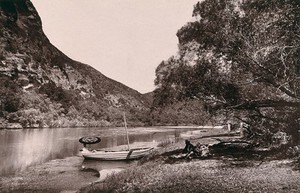 view St Francis Bay, South Africa: part of the Gamtoos River and a boat. Woodburytype, 1888, after a photograph by Robert Harris.