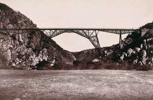 view Blauw Krantz Bridge, South Africa: a ravine and railway bridge. Woodburytype, 1888, after a photograph by Robert Harris.