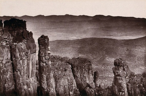 Valley of Desolation, South Africa: rock formations overlooking a barren valley near Graaff-Reinet. Woodburytype, 1888, after a photograph by Robert Harris.