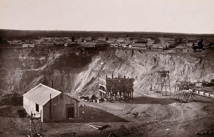 Kimberley, South Africa: the Kimberley mine and town. Woodburytype, 1888, after a photograph by Robert Harris.