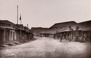 view Kimberley, South Africa: men at the diamond market. Woodburytype, 1888, after a photograph by Robert Harris.