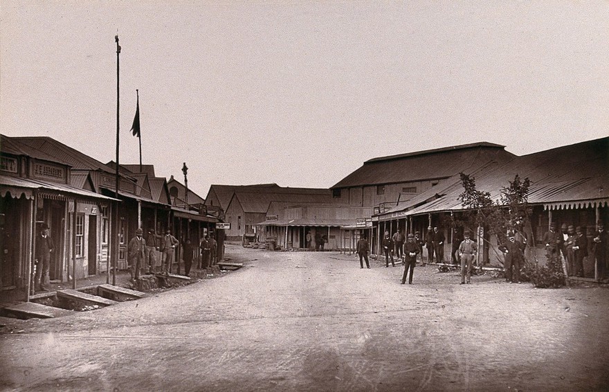 Kimberley, South Africa: men at the diamond market. Woodburytype, 1888, after a photograph by Robert Harris.