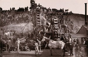 view Kimberley, South Africa: miners and washing gear at the Bultfontein diamond mine. Woodburytype, 1888, after a photograph by Robert Harris.