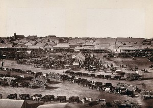 view Kimberley, South Africa: a morning market in the town. Woodburytype, 1888, after a photograph by Robert Harris.