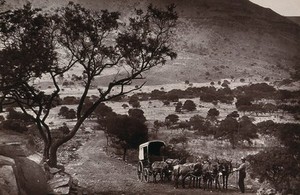 view Little Hell, South Africa: the road to Barberton through a barren valley at the base of the Elandsberg mountains. Woodburytype, 1888, after a photograph by Robert Harris.