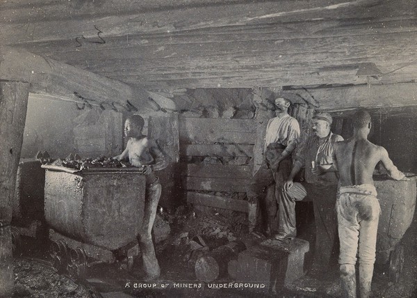 South Africa: a group of miners working underground at De Beers diamond mine. Photograph by J.E.M., 1896.