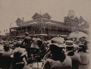 view South Africa: a large crowd of people gathered outside a building in Johannesburg. 1896.