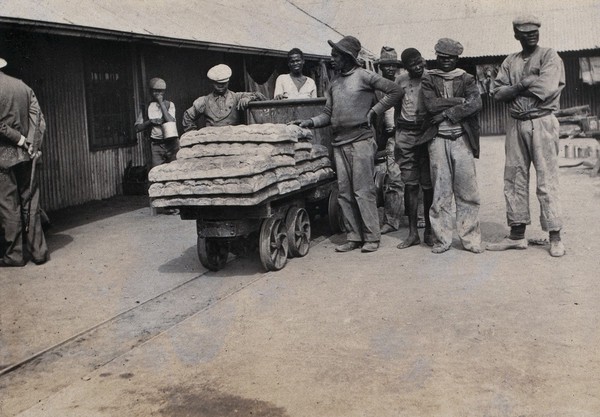 South Africa: bread carried on trolleys for the African workers at De Beers Mine. Photograph by Hugh Marshall, 1905.