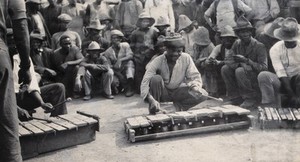 view South Africa: African workers playing instruments at Dutoits Pan Mine. Photograph by A.B. Macallum, 1905.
