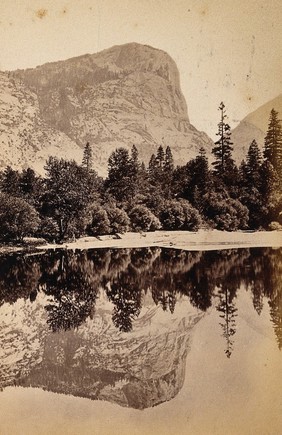 Yosemite National Park, California: Glacier Point with its reflection showing in Mirror Lake: panoramic view: section two. Photograph, ca. 1880.