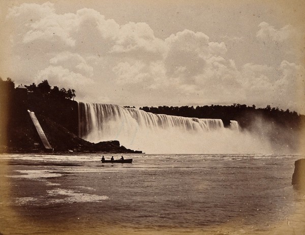 Niagara Falls: the American Falls; a rowing boat in the foreground. Photograph, ca. 1880.
