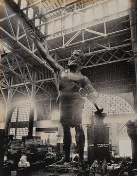 The 1904 World's Fair, St. Louis, Missouri: Vulcan, the Roman god of the forge: a 56 foot high statue in the Palace of Mines and Metallurgy. Photograph, 1904, of a cast iron statue by Giuseppe Moretti, ca. 1904.