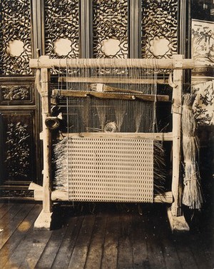 view The 1904 World's Fair, St. Louis, Missouri: a Chinese loom for wicker-work weaving. Photograph, 1904.