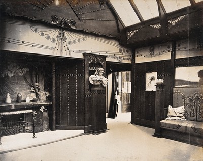 The 1904 World's Fair, St. Louis, Missouri: the Prague School for Arts and Crafts exhibit: an art nouveau interior with a decorative fireplace and wooden panelling. Photograph, 1904.