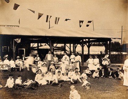 The 1904 World's Fair, St. Louis, Missouri: the children's creche: children and staff: group portrait. Photograph, 1904.