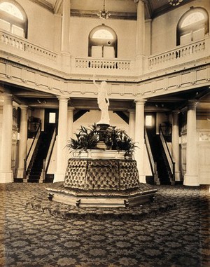 view The 1904 World's Fair, St. Louis, Missouri: the Brazil pavilion: a statue above an octagonal seat. Photograph, 1904.