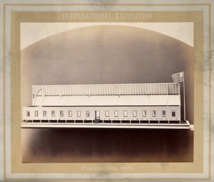 view Philadelphia International Exposition, 1876: U.S. military hospital barrack ward: a model with the roof raised. Photograph, 1876.