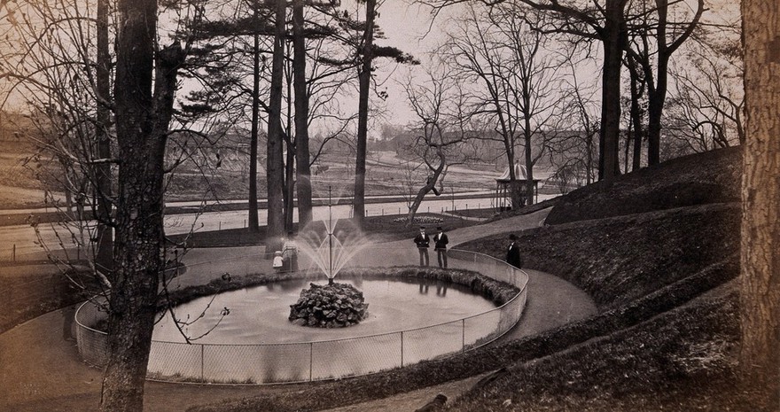 Fairmount Park, Philadelphia, Pennsylvania: park visitors next to a small lake with a fountain. Photograph by Francis Frith, ca. 1880.