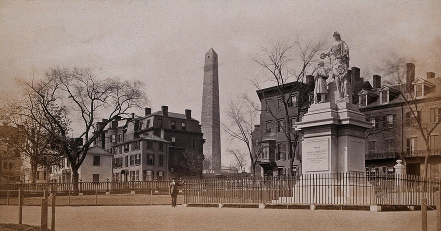 Bunker Hill, Boston, Massachusetts: a war memorial, erected in 1872; the Bunker Hill monument is in the background. Photograph, ca. 1880.