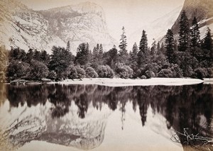 view Mirror Lake, Yosemite Valley, California: snow-covered mountain and trees reflected in lake. Photograph, ca. 1880.