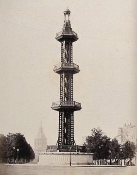 An (iron?) tower with Hôtel Les Invalides in the background, Paris, France. Photograph by Achille Quinet, ca. 1870.