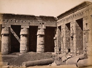 view Luxor, Egypt: the Temple of Ramesses III at Medinet Habu: columns in the Second Court. Photograph by Pascal Sébah, ca. 1875.