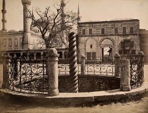 view The Hippodrome, Istanbul, Turkey: the bronze Serpentine Column with the Blue Mosque in the background. Photograph by Guillaume Berggren, ca. 1880.