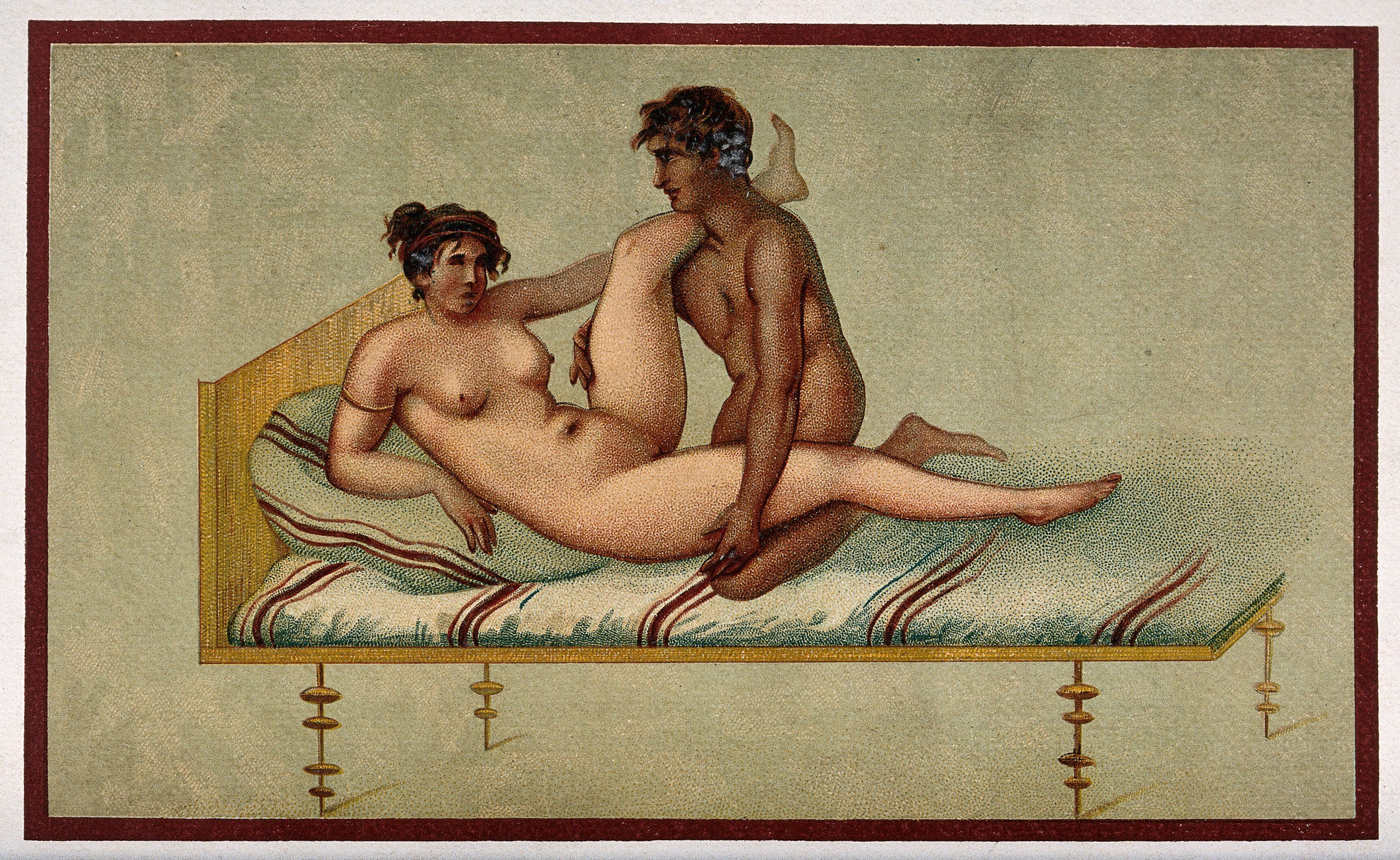A naked man and woman in sexual congress on a