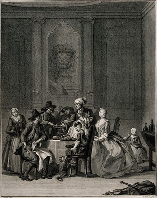 People having a meal with a woman presiding over the table. Engraving by J. Houbraken after C. Troost.