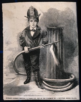 A small boy stands by a fire hydrant with a fireman's helmet on and a fire hose in his hand. Wood engraving.