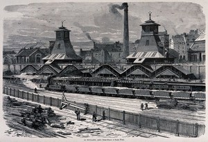 view Coal and coke works at Le Creusot, Saône-et-Loire: a railway siding with coal drops, railway trucks carrying coal, and colliery buildings. Wood engraving by H. Linton after J. Férat.