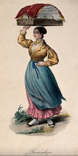 A woman is carrying a large, flat basket of clean washing on her head. Coloured lithograph.