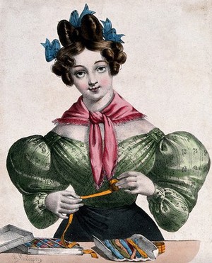 view A woman is unreeling ribbon to wind it on to cards. Coloured lithograph by Charles Philipon.