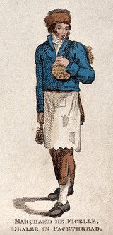 A man is carrying reels of thread in bundles. Coloured etching.