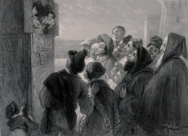 A crowd of people have gathered around a stand in the street to watch a Punch and Judy show. Engraving by J. Goodyear after T. Uwins.