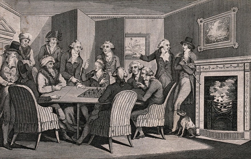Men gathered around a table as Philidor plays a game of chess wearing a blindfold. Engraving.