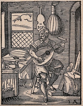 A lute-maker testing one of the lutes in his workshop: other musical instruments are hanging on the walls, and there are tools on and around the workbench. Woodcut by Jost Amman, 1568.